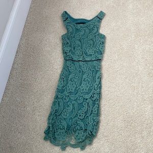 Darker mint lace dress with fun peep hole back